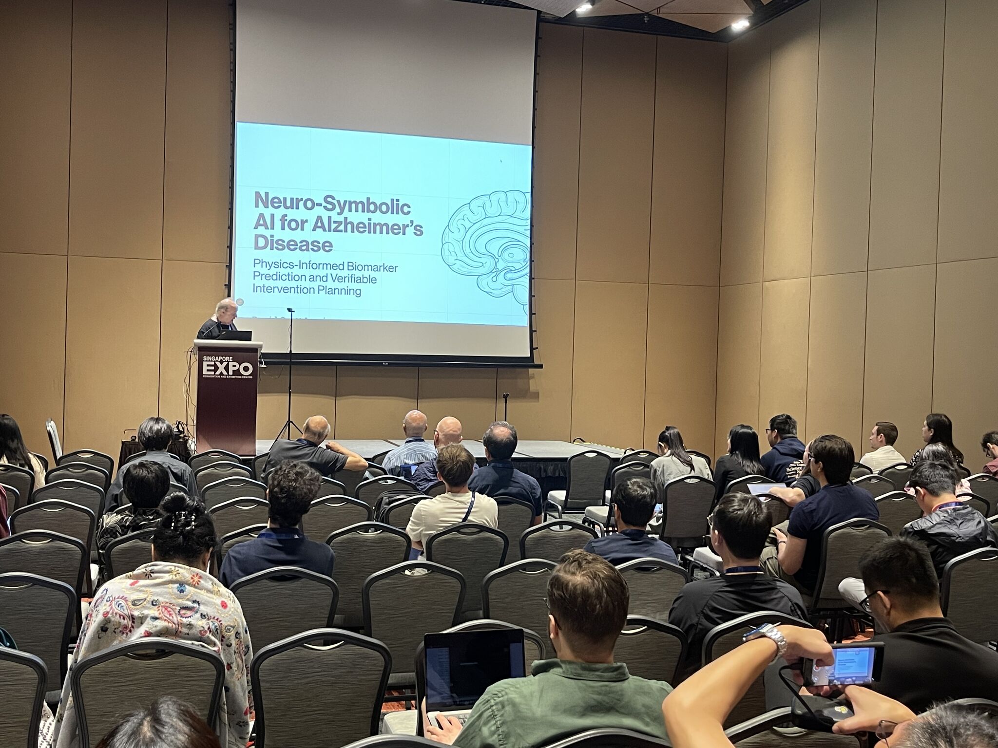 David Scott Lewis delivering oral presentation on Neuro-Symbolic AI for Alzheimer's Disease at AAAI-26, Singapore Expo